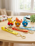 Collection of colorful 3D Pokémon Pokéball keychains featuring Pikachu, Bulbasaur, Charmander, Squirtle, Eevee, and Psyduck with matching wrist straps