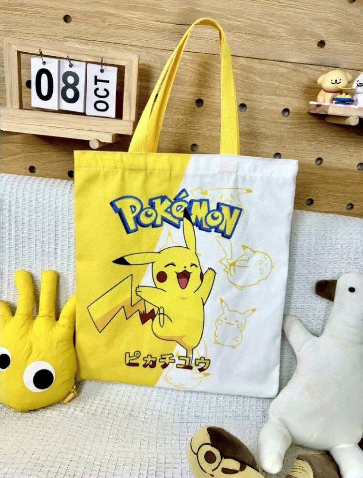 Official Pokémon Pikachu Canvas Tote bag with vibrant yellow and white split design featuring Pikachu and reinforced yellow shoulder straps