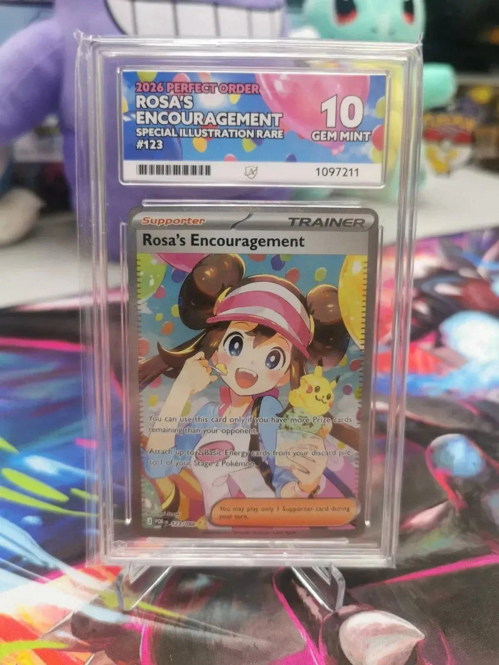 Pokemon Rosa's Encouragement 123/088 full art Trainer card featuring Ace with holo finish, graded PSA 10